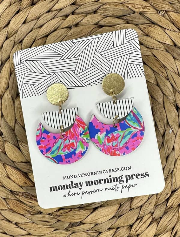 colorful crescent-shaped paper earrings on shop backing card